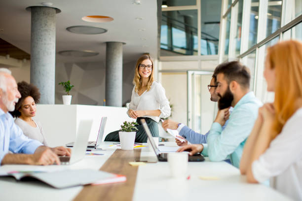 istock Joyful multiracial business team at work in modern office 993978580