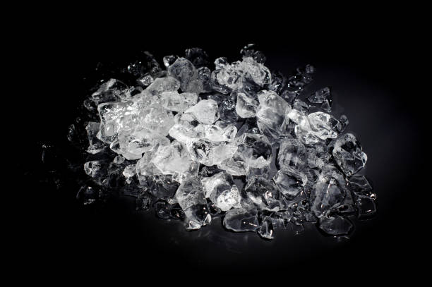 istock Heap of a white and transparent small ice cubes 993981656