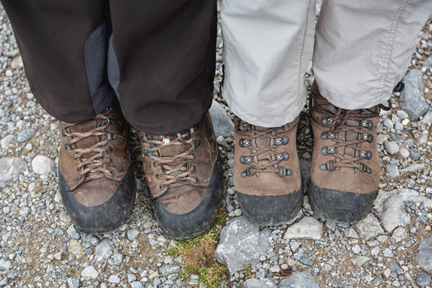 istock hiking boots of senior couple on stony mountain path 993982018