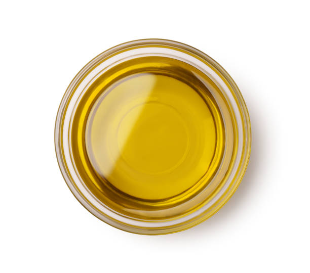 Oilve oil Top view of olive oil bowl isolated on white cooking oil photos stock pictures, royalty-free photos & images