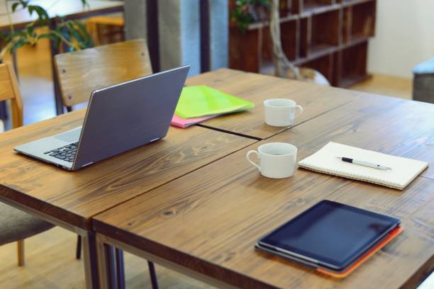 istock Desk at coworking lounge 993986224