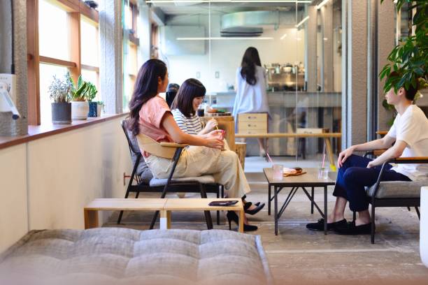 istock Group of friends sitting together at a cafe 993987404