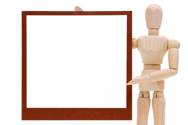 istock Wooden dummy with blank instant photo 994009408