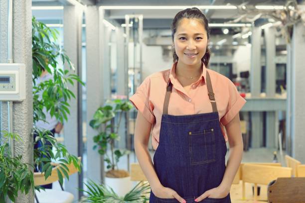 istock Cheerful cafe owner looking at the camera 994010912