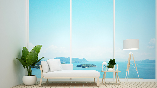 Daybed on living room with sea view and bright sky in hotel or resort - Living room simple design artwork for vacation time - 3D Rendering