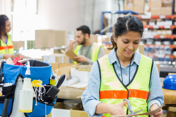 istock Cheerful mid adult distribution warehouse employee at work 994021400