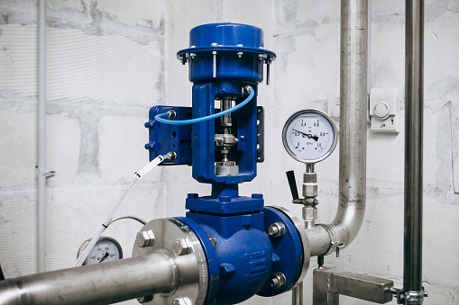 Blue pump connected to pipes