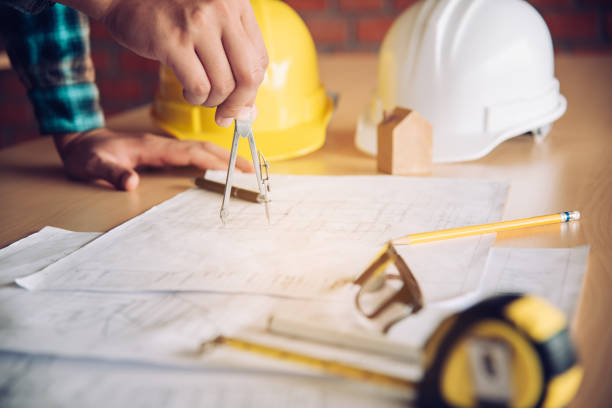 istock Engineering teams are meeting to present and discuss construction work designed and implemented. 994059930
