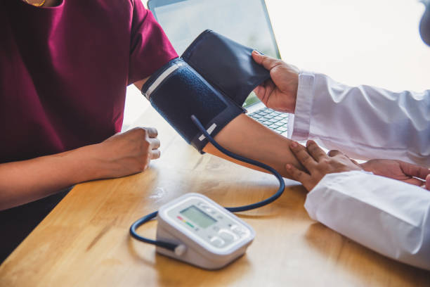 istock doctor measuring blood pressure from her patient 994060224