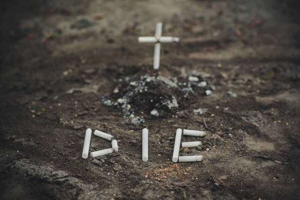 istock ashtray with ash and cigarette look like grave and cross 994060818