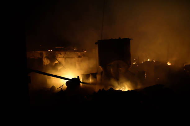 istock Silhouette of fireman fighting bushfire at night 994066226
