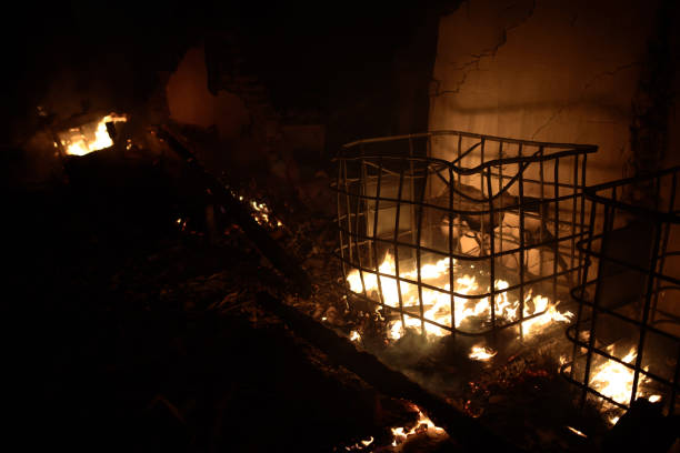 istock Silhouette of fireman fighting bushfire at night 994066452