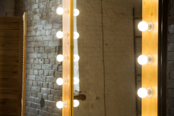 istock Close-up of a large mirror in a room with a brick wall 994077356