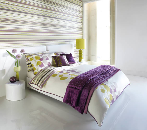 King-size bed in the master bedroom of this coach home.