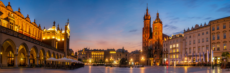 Cracow, Poland-26 June 2018:Night panorama of the old town market square .Cloth Hall and St Mary s Church at Main Market Square in Cracow