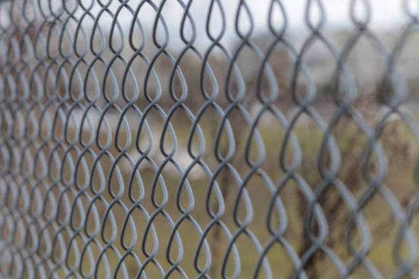 istock Chain Link Fence Close up 994084706