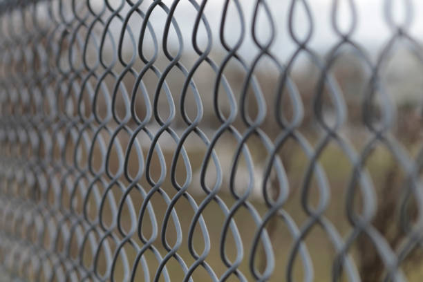 istock Chain Link Fence Close up 994084710