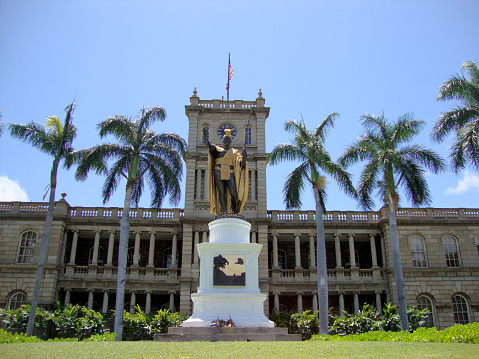 Statue of King Kamehameha in downtown Honolulu, Hawaii.  statue stands prominently in front of AliÊ»iolani Hale in Honolulu, Hawaii. The statue had its origins in 1878 when Walter M. Gibson, a member of the Hawaiian government at the time, wanted to commemorate the 100-year arrival of Captain Cook to the Hawaiian Islands. Taken on April 23, 2010.