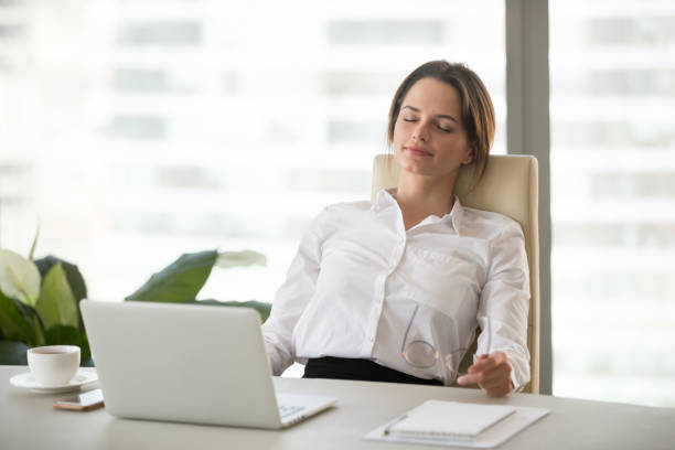 istock Young woman relaxing enjoying break on comfortable ergonomic office chair 994101716