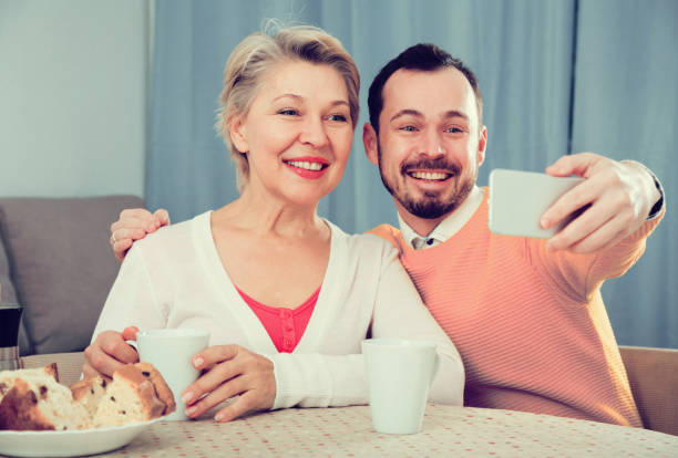 istock Mother and son taking photos 994112480