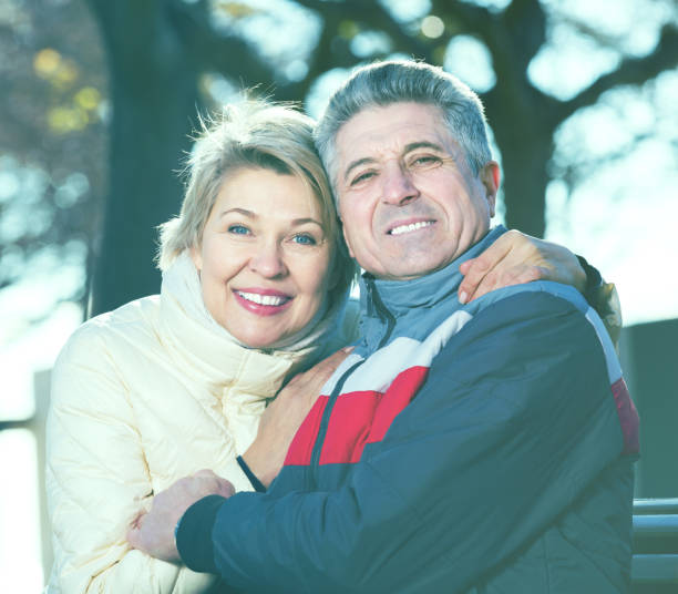 istock Mature couple on park bench 994113166