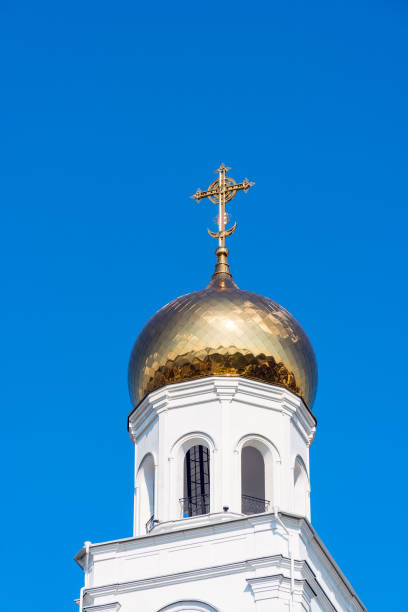 istock Golden cross on bell tower dome 994118540