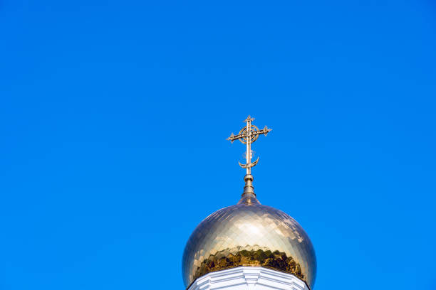 istock Golden cross on bell tower dome 994118648