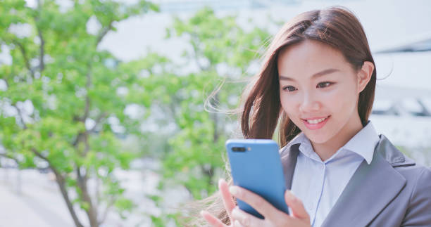 istock business woman use phone 994122664