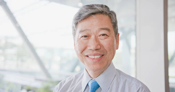 istock old businessman smile happily 994140032