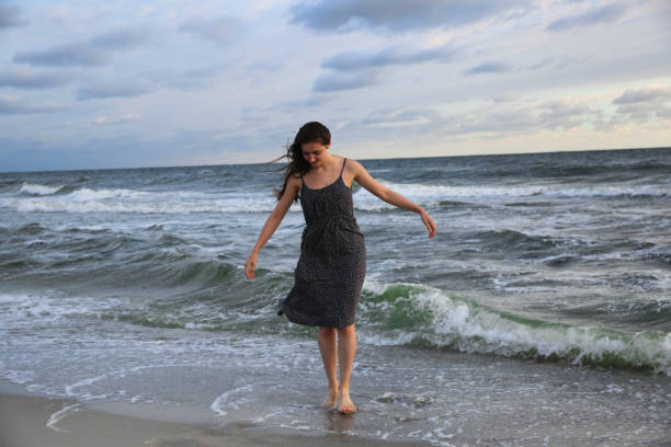 istock Woman on the sea coast 994140686