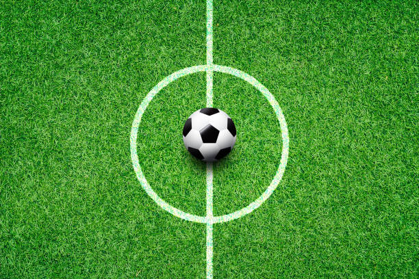 istock soccer field center and ball top view background 994140878
