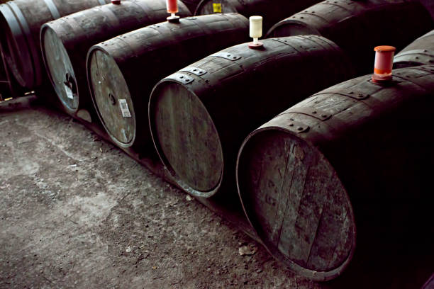 istock Cider barrels in cider production farm basement 994141064