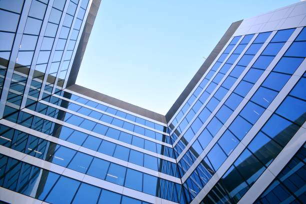 istock Blue clean glass wall of modern skyscraper 994143944