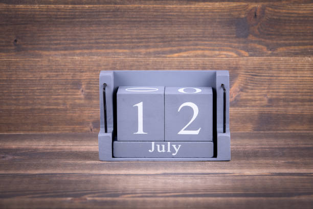 istock 12 July. Wooden, square calendar 994148272