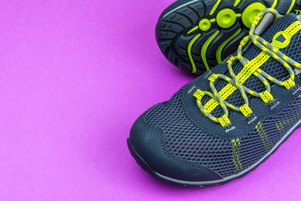 istock Men's summer grey sneakers on a purple background 994151864