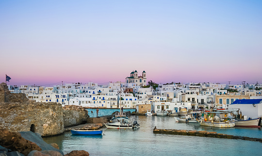 old port in the village on the island of Paros at sunset. Greece