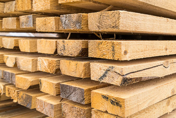 high stack of building materials natural materials eco house heat preservation background construction design high stack of building materials natural materials eco house heat preservation background construction design lumber industry timber lumberyard industry stock pictures, royalty-free photos & images