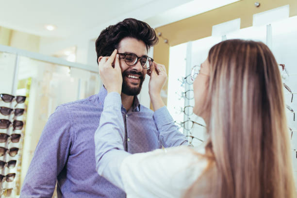 istock Ophthalmologist doing a visual examination for a customer at an optical center. 994158492
