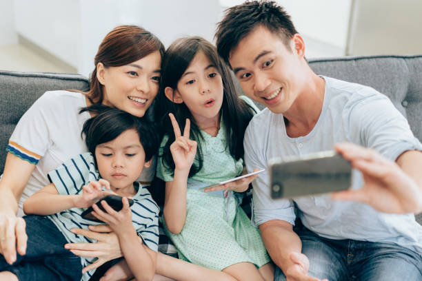 istock Happy family taking a selfie 994158502