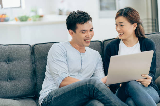 istock Beautiful couple sharing a laptop 994158532