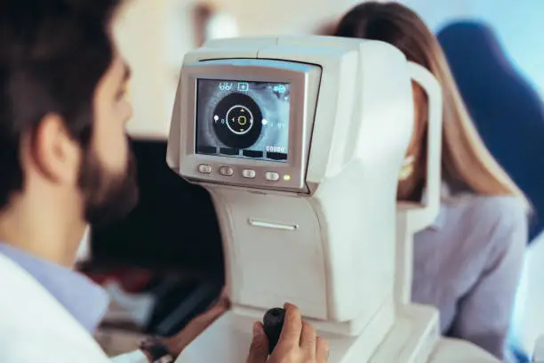 Photo of Girl woman in ophthalmology clinic for diopter detection