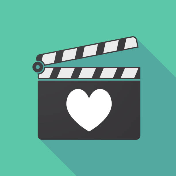 istock Long shadow clapper board with  the heart poker playing card sign 994159180