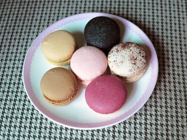 istock Delicious and colorful macaroon places on white plate. 994160342