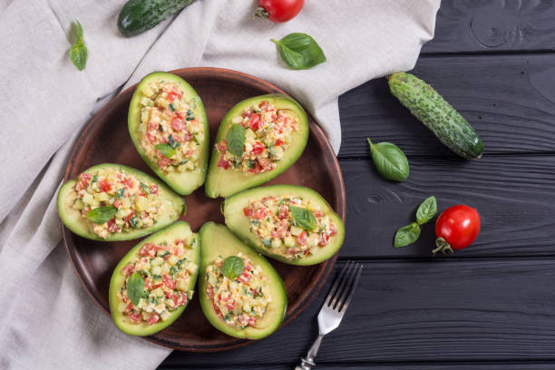 istock Avocado stuffed with cucumber , tomatoes and eggs 994161606