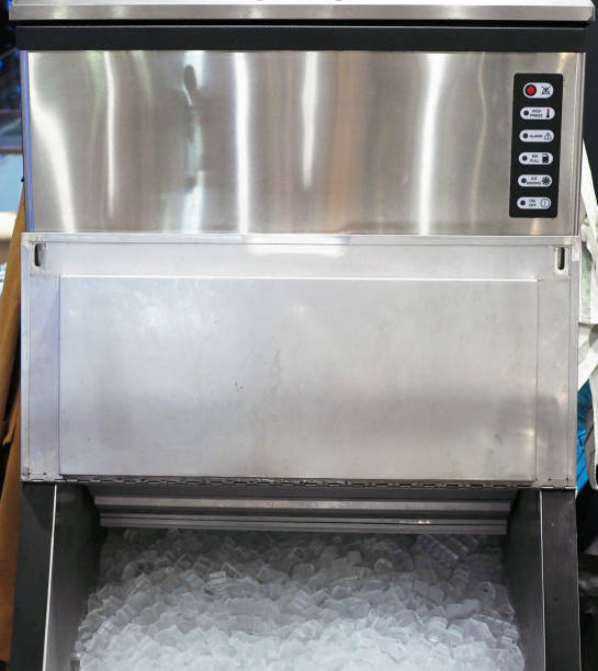 An ice making machine which placed in modern restaurant. An ice making machine which placed in modern restaurant. Selective focus. ice machines stock pictures, royalty-free photos & images