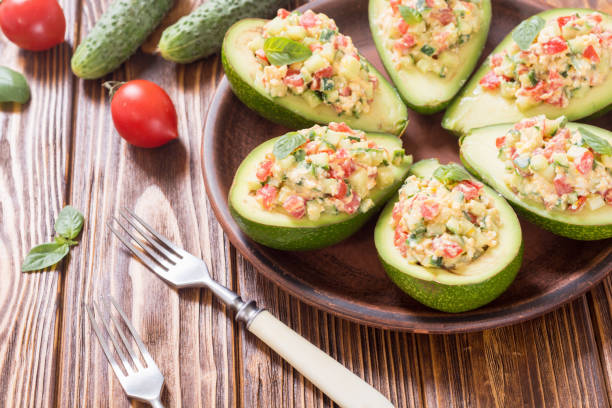 istock Avocado stuffed with cucumber , tomatoes and eggs 994162590