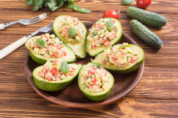 istock Avocado stuffed with cucumber , tomatoes and eggs 994164188