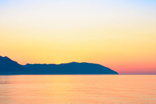 istock Red sunset over calm sea 994164288