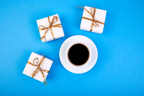 istock White gift box with gold ribbon 994168364