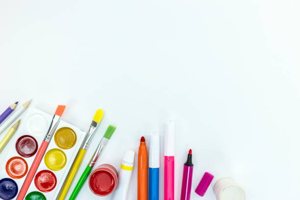 istock watercolor paints, brushes, pencils on white background 994171826